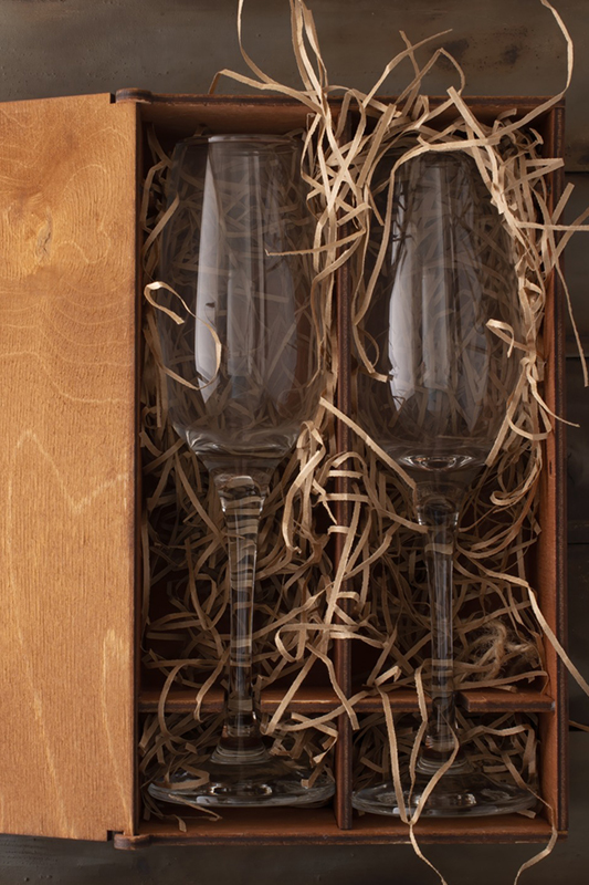 woodeen box with champagne flutes in wood wool packing