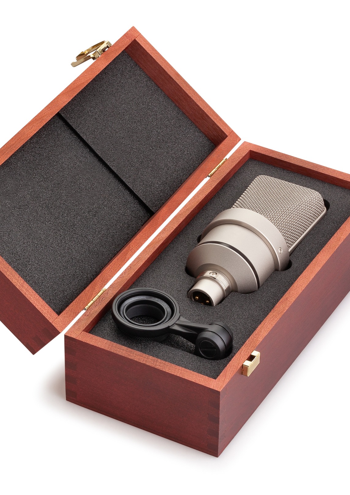 A wooden box opened on a table showing a Microphone head in a foam insert
