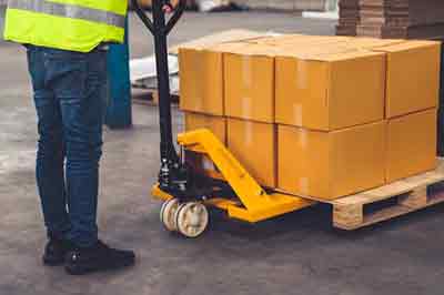 cardboard cartons on a pallet truck