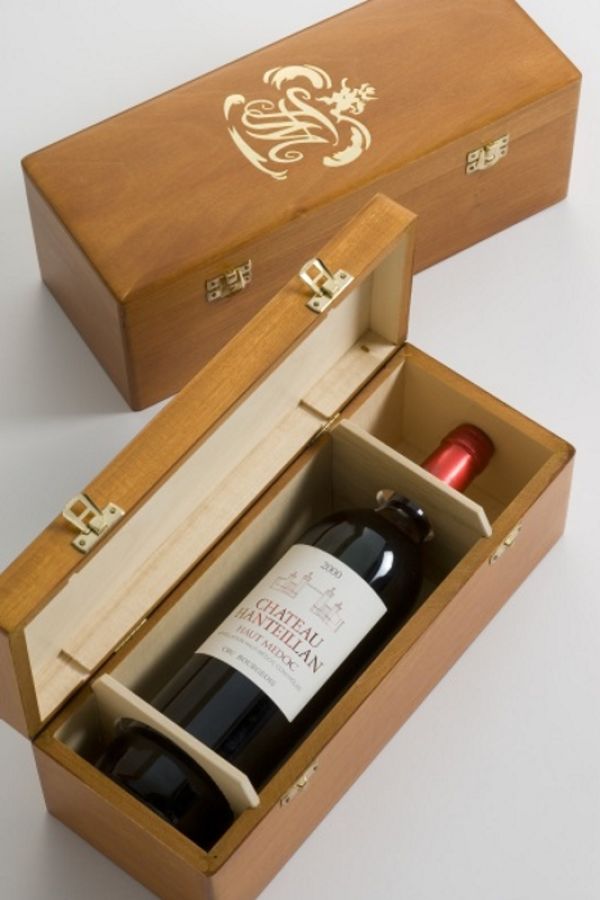 a single bottle of wine in a handcrafted wooden display box, the lid is open so you can see inside