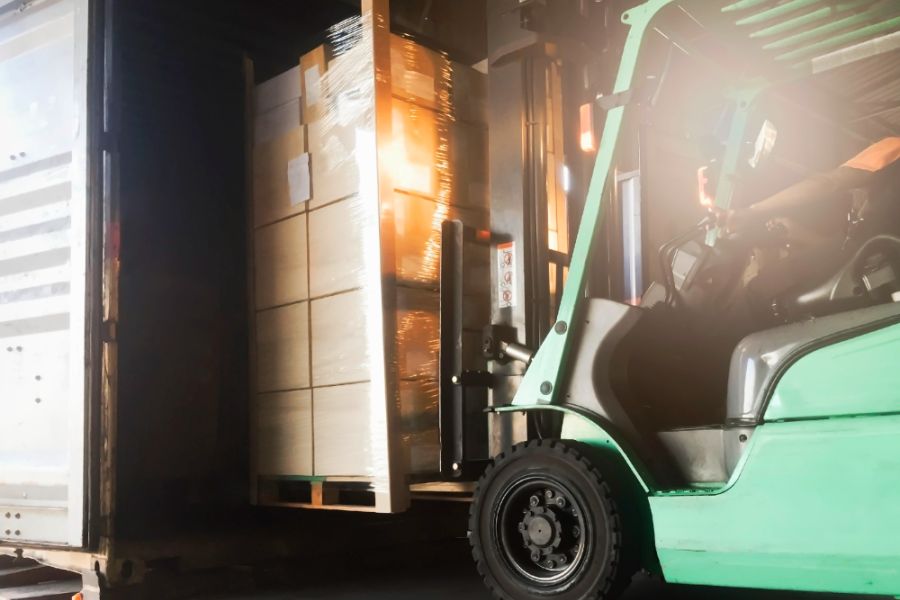 fork truck unloading a lorry
