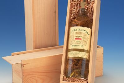 wooden boxes on a table with bottles of wine in them, it has a clear glass cover so you can see inside