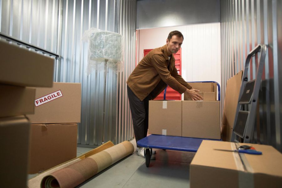 man packing boxes
