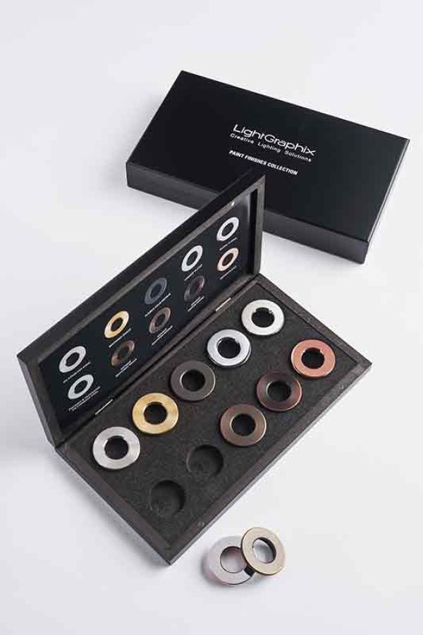 a wooden tool box with round disc shaped objects inside