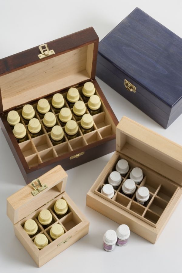 wooden display boxes with bottles of essential oils