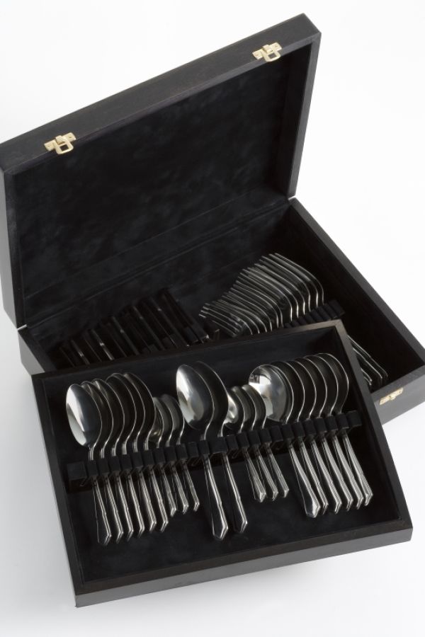 a dark wooden bboox with a pull out tray with silverware inside