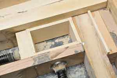 a wooden box in a mitred clamp