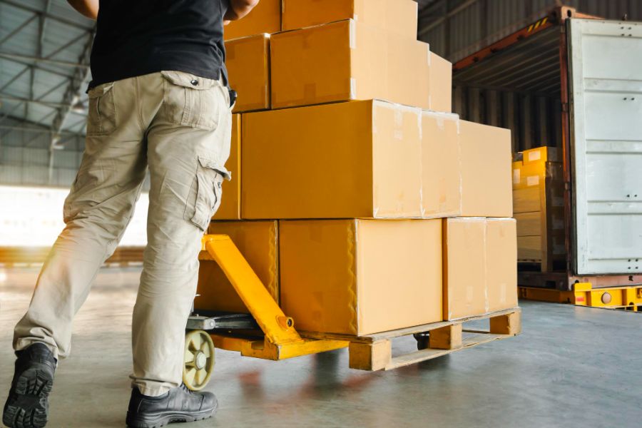Pan loading boxes into a lorry on a pallet truck