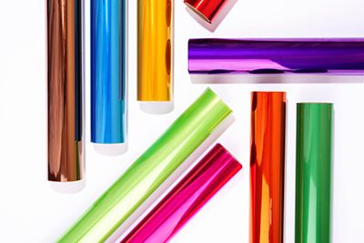 rolls of different coloured metallic foils on a white background