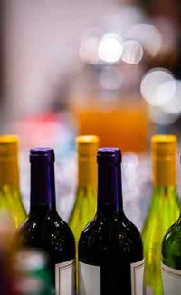 Bottles of wines with a blurred coloured background