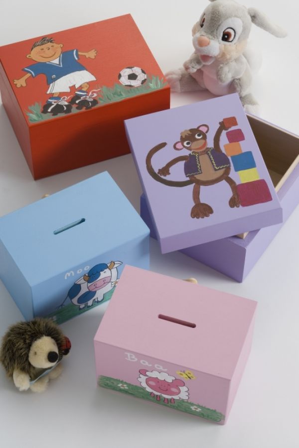 pink, blue and red wooden money boxes for children decorated with cartoon characters