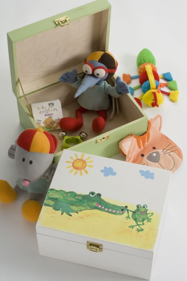 wooden painted boxes with small toys scattered about