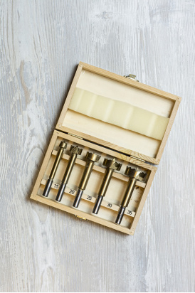 wooden box with drill bits